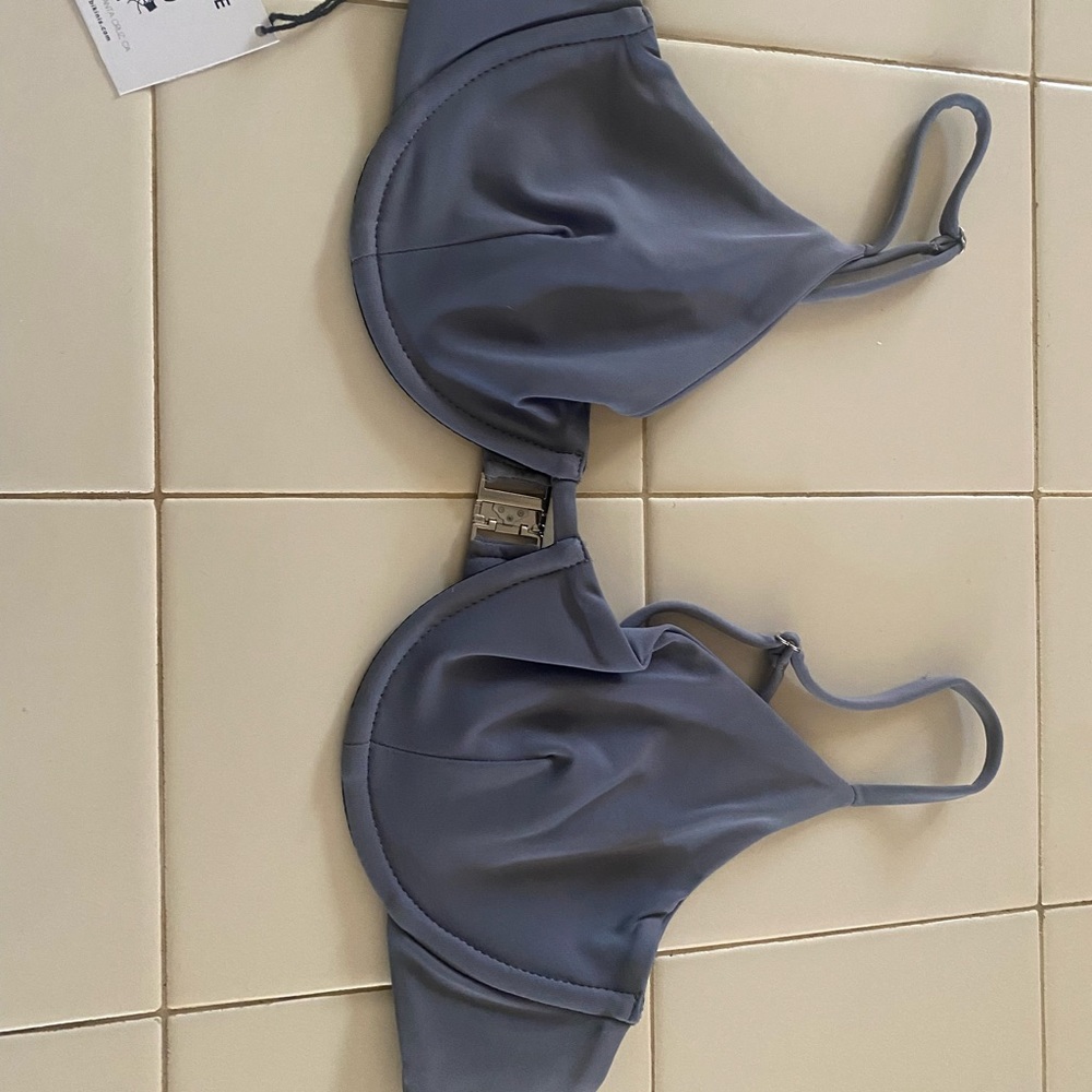 Strange Bikini top, 32 B/C, new with tags, never worn. Wrong size and final sale